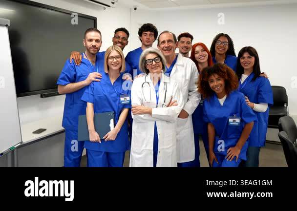 Proud multiethnic group of doctors and nurses smiling while posing ...