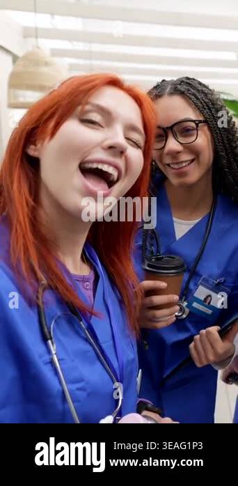 Diverse group of happy young nursing students in blue scrubs smiling ...