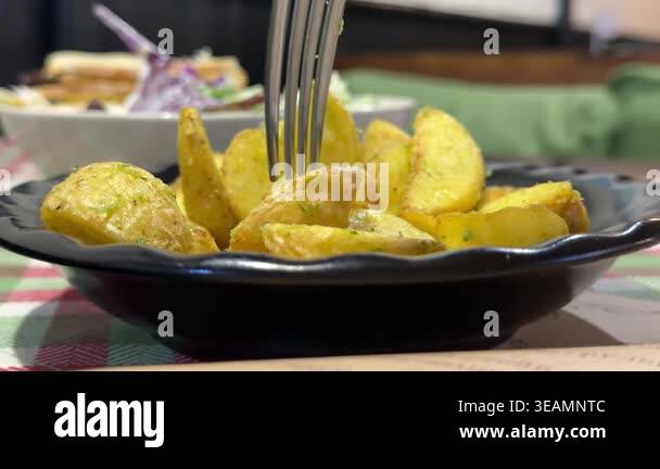 Close Up Baked Potato Until Crisp Fork With Potato Wedges High