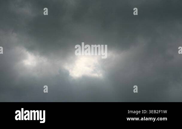 Dramatic Overcast Sky with Bright Light Peeking Through Dark Clouds and ...
