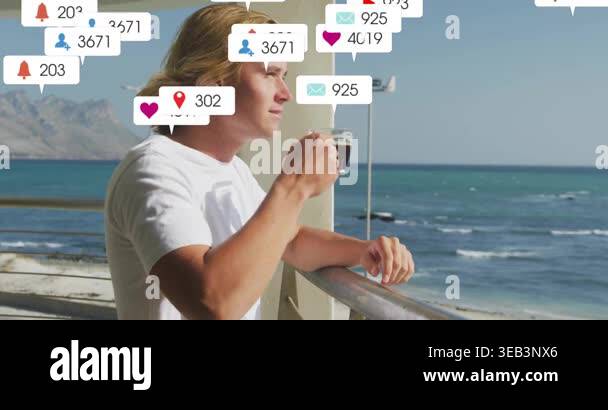 Man sipping coffee on seaside balcony, engaging social media marketing ...