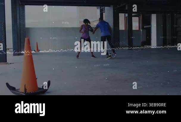Man touching ball and dribbling while woman defending, training drill ...