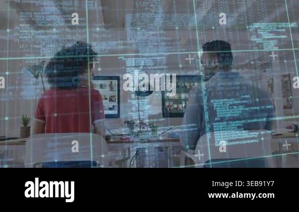 Software developers typing code at shared desk and celebrating ...