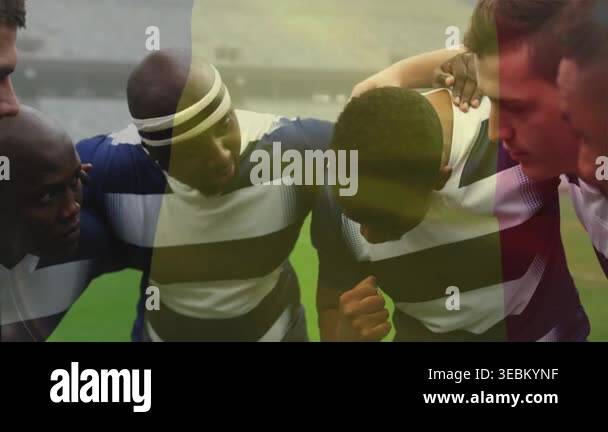 Unity Ball Team Rugby Rugby team forming huddle, player raising fist and uniting team pregame ...