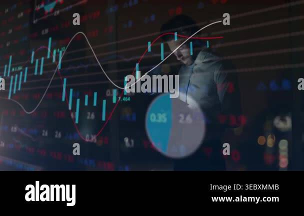 Trader tapping tablet, sparking charts and tickers overlaying him while ...