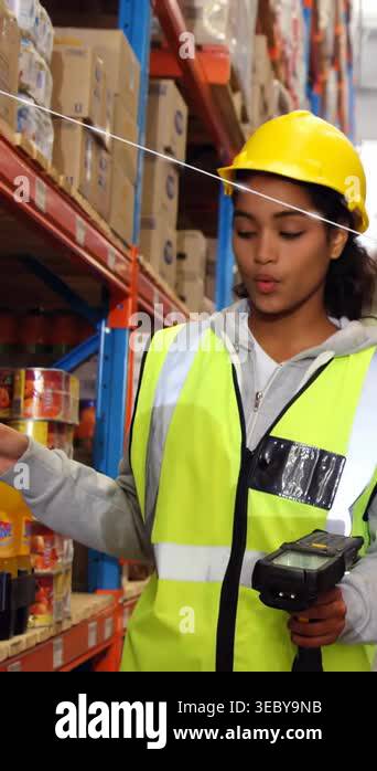 Picker Logistics Vertical video: Logistics picker using scanner scanning shelf and ...