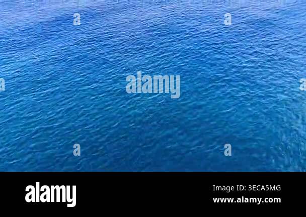 Top down view of blue sea water surface texture. Minimalist aerial shot ...