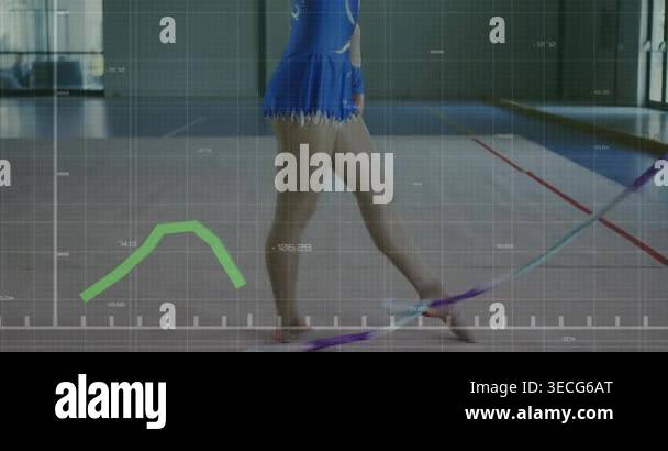 Shifting gymnast in blue leotard swinging ribbon doing routine at gym ...