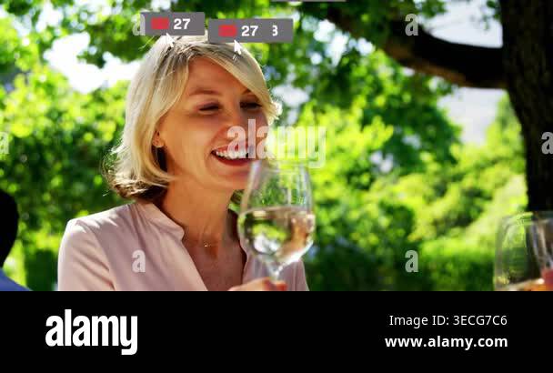Woman raising glass, social media icons swelling over face and glass ...