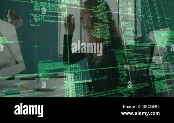 Woman typing and clicking at desk reviewing tech data while code ...