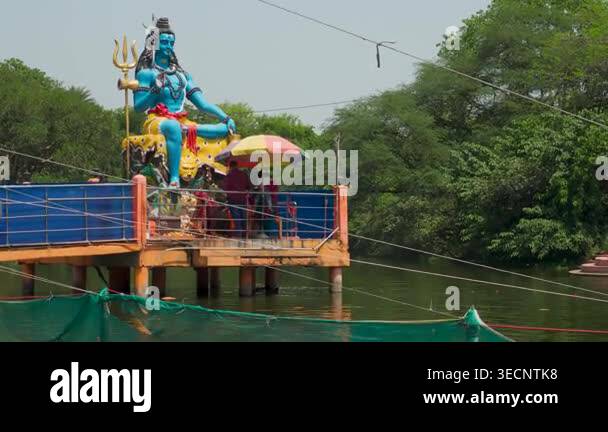 April15th2026 Lucknow India. Shiva statue at lakeside Chandrika Devi ...