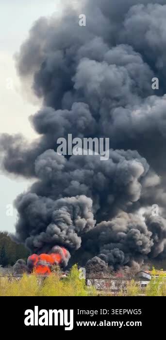 Large fire with thick black smoke rising over urban area in Prague ...
