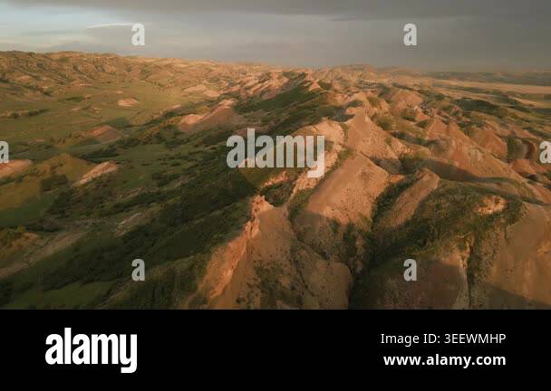 Aerial fly over rainbow or red mountains, colorful layers of the ...