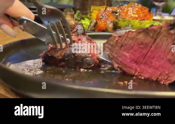 Man cut meat steak, beef pork neck cooking, Cook Butcher. The chef cuts ...