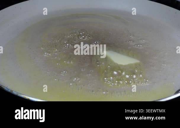 Close-up of butter melting in frying pan Stock Video Footage - Alamy