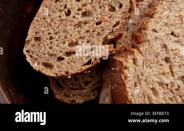Top view of traditional German multigrain bread slices with seeds and ...