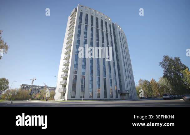 Modern high-rise building with sleek facade and numerous private ...