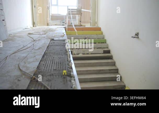 Construction site features unfinished stairs with colorful accents ...