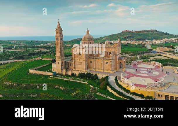 Drone sunset view of catholic Ta' Pinu church on Gozo, Maltese island ...
