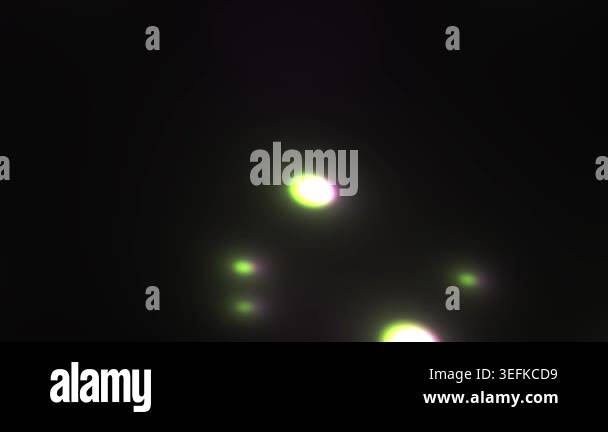 Abstract view of bright glowing lights moving and flickering against a ...
