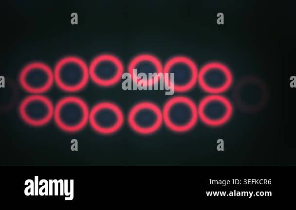 A collection of abstract red neon circles that glow and pulsate against ...