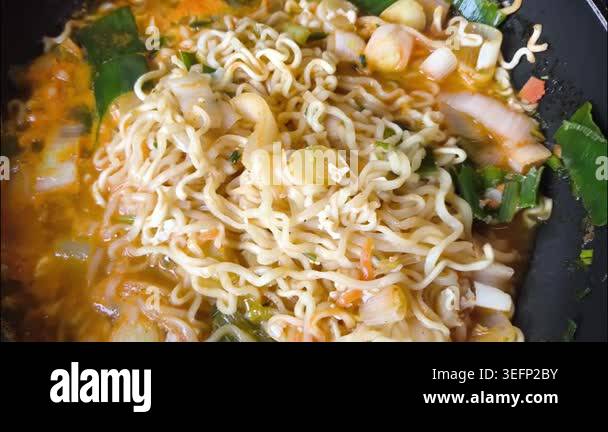 Boiling noodles with vegetable in pot, indoor Chiangmai Thailand Stock ...