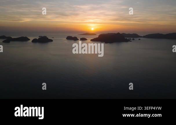 Sunset with yellow orange color over the Islands in El Nido. Palawan ...