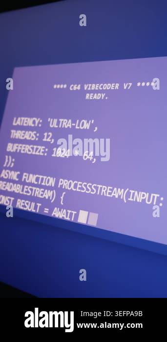 Retro computer screen displays programming code for an asynchronous ...