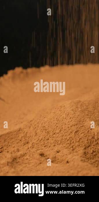 Vertical slow motion cocoa sprinkle on black background Stock Video ...