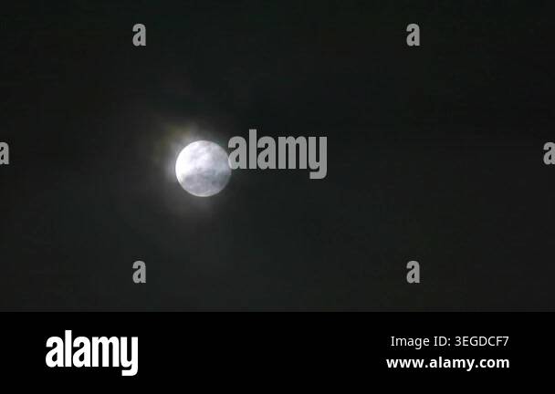 A captivating image of a bright full moon shining in the night sky. The ...