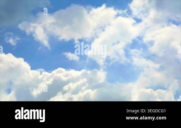 A captivating view of a bright blue sky adorned with fluffy white ...