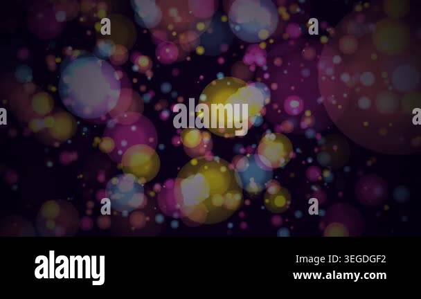 Abstract festive motion background with colorful floating bokeh light ...