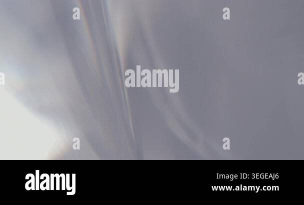 Abstract silver blurry background with moving lens flares and ...