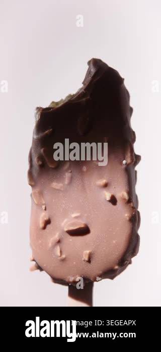 Closeup Video of bitten off Chocolate Almonds Ice Cream Stick Bar ...