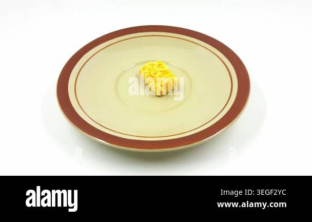 This high definition video shows a single golden cheese pastry cookie ...