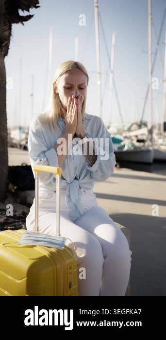 Young woman traveler wearing casual clothes, hold yellow suitcase while ...
