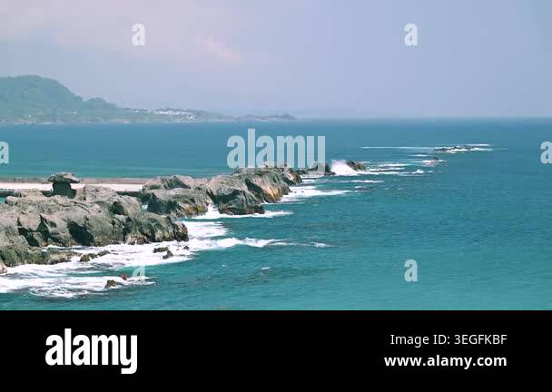 A scenic view of the rocky coastline at Shiyusan Coast Park in ...