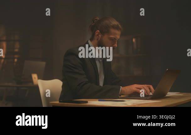 latenight creative director brainstorming with moodboard and laptop ...