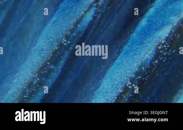 Ink wave defocused. Lens fluid. Glitter stripe trickles stream mix ...