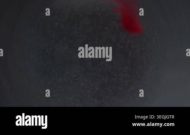 Fume swirl defocused. Sphere ink. Red drop pigment flow underwater on ...