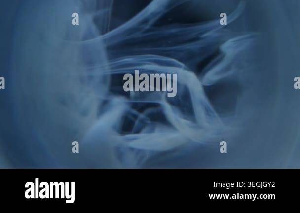 Defocused round splash. Ink fog. Blue gray pigment dripping in mix ...