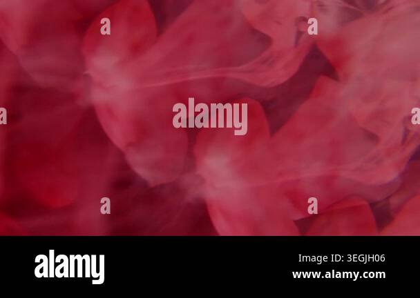 Defocused haze mix. Ink blob. Bright red color dye dissolving ...