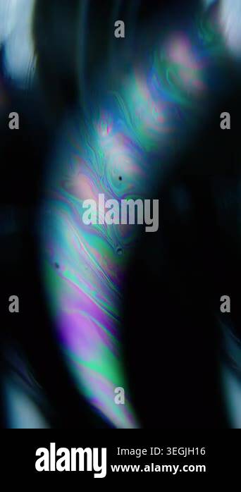 Vertical video. Defocused color fluid. Paint water. Purple blue green ...