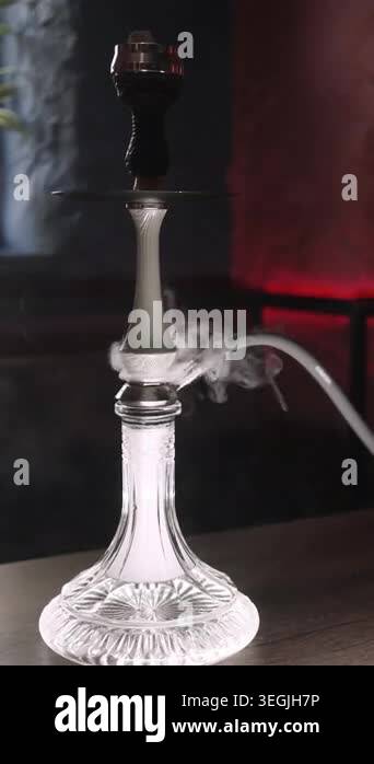 Vertical video. Smoky hookah lounge. Modern shisha. Vapor tobacco in ...