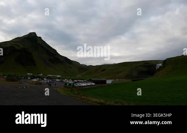 Wide-angle establishing shot of Skogafoss waterfall in South Iceland ...