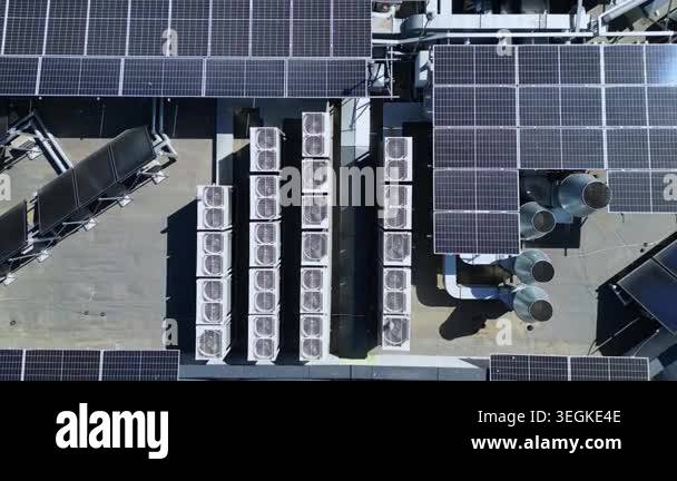 High-angle aerial drone shot of a large solar panel installation on a ...