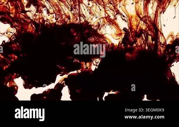 A stock video capturing swirling ink in water, forming intricate ...