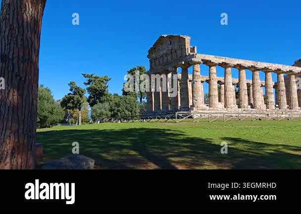 Ancient Greek Temple of Athena in Paestum, Italy at sunny day with blue ...