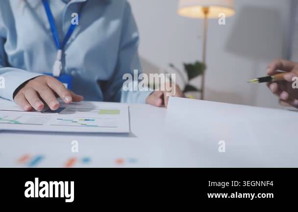 close up of businessman holding pen and writing notes in the office ...