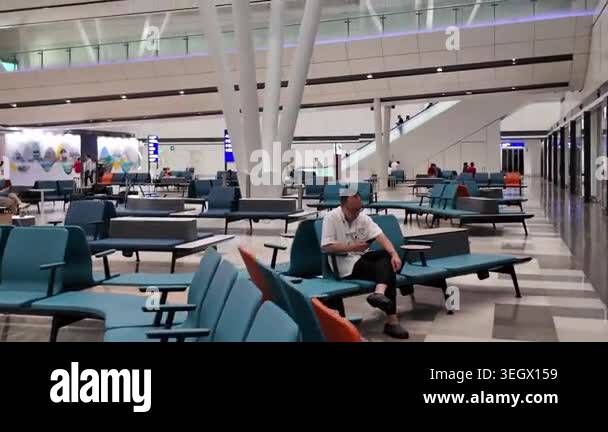 Hong Kong Airport arrivals hall with passengers and signage April 24 ...